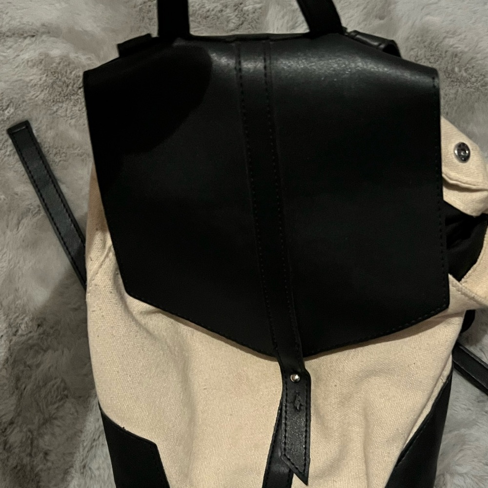 Fabric backpack with pleather straps